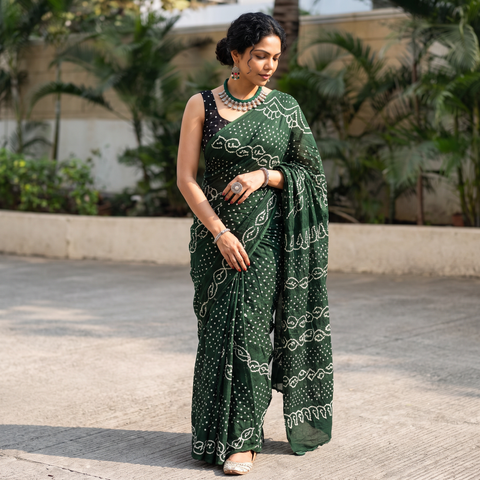 Green Kutch Bandhani tie-dye cotton saree, draped and worn by a woman, AI visual of the saree, iTokri