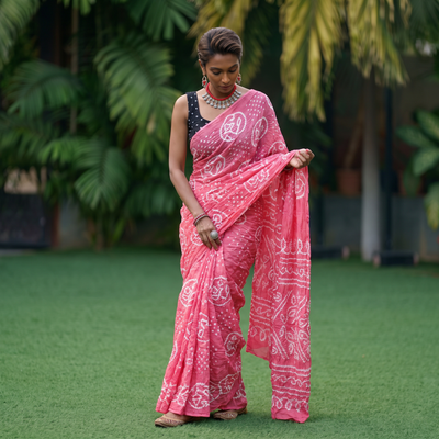 Pink Kutch Bandhani tie-dye cotton saree, draped and worn by a woman, AI visual of the saree, iTokri