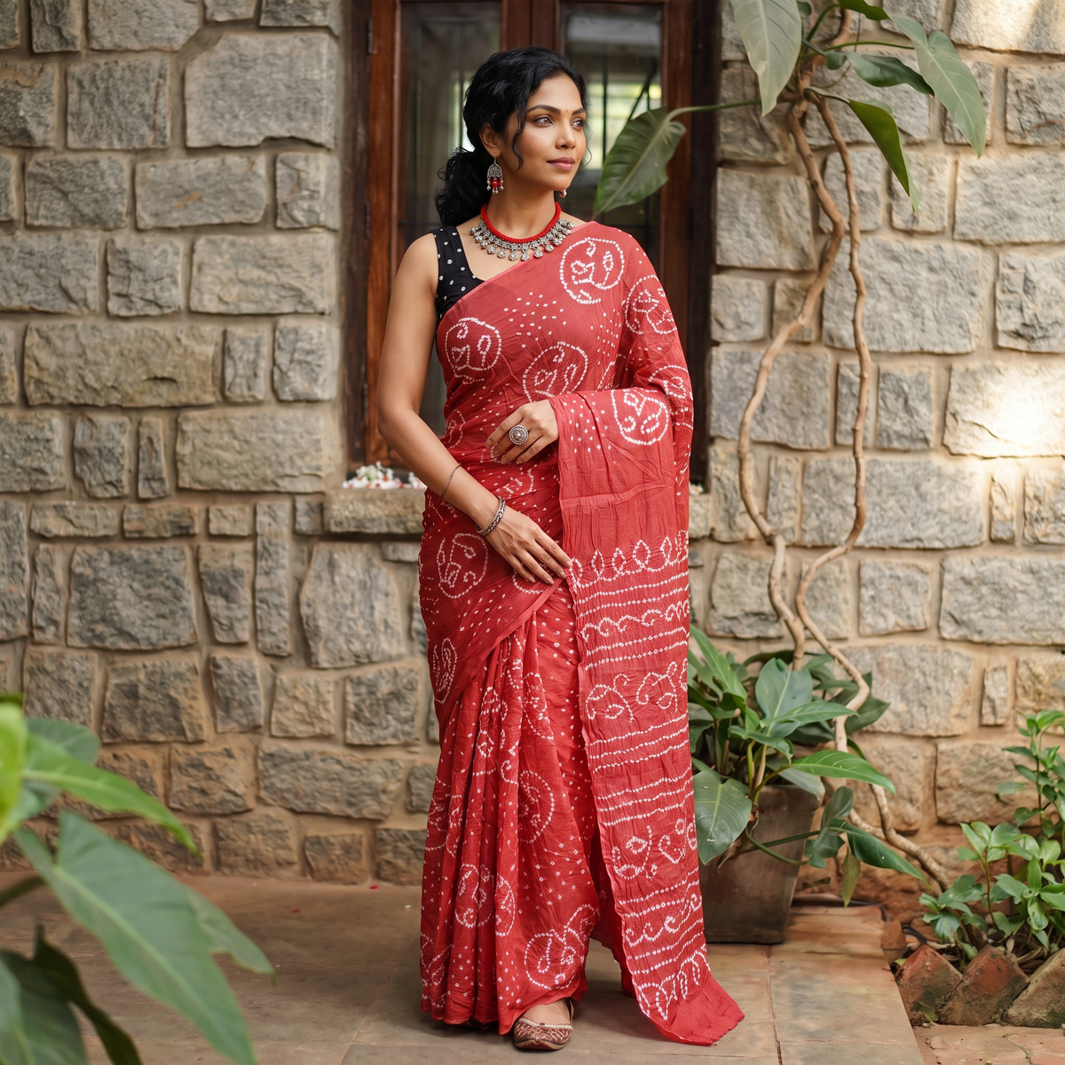 Pink Kutch Bandhani tie-dye cotton saree, draped and worn by a woman, AI visual of the saree, iTokri