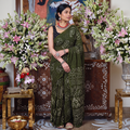Green Kutch Bandhani tie-dye cotton saree, draped and worn by a woman, AI visual of the saree, iTokri