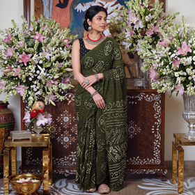 Green Kutch Bandhani tie-dye cotton saree, draped and worn by a woman, AI visual of the saree, iTokri