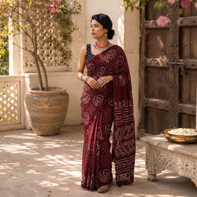 Maroon Kutch Bandhani tie-dye cotton saree, draped and worn by a woman, AI visual of the saree, iTokri