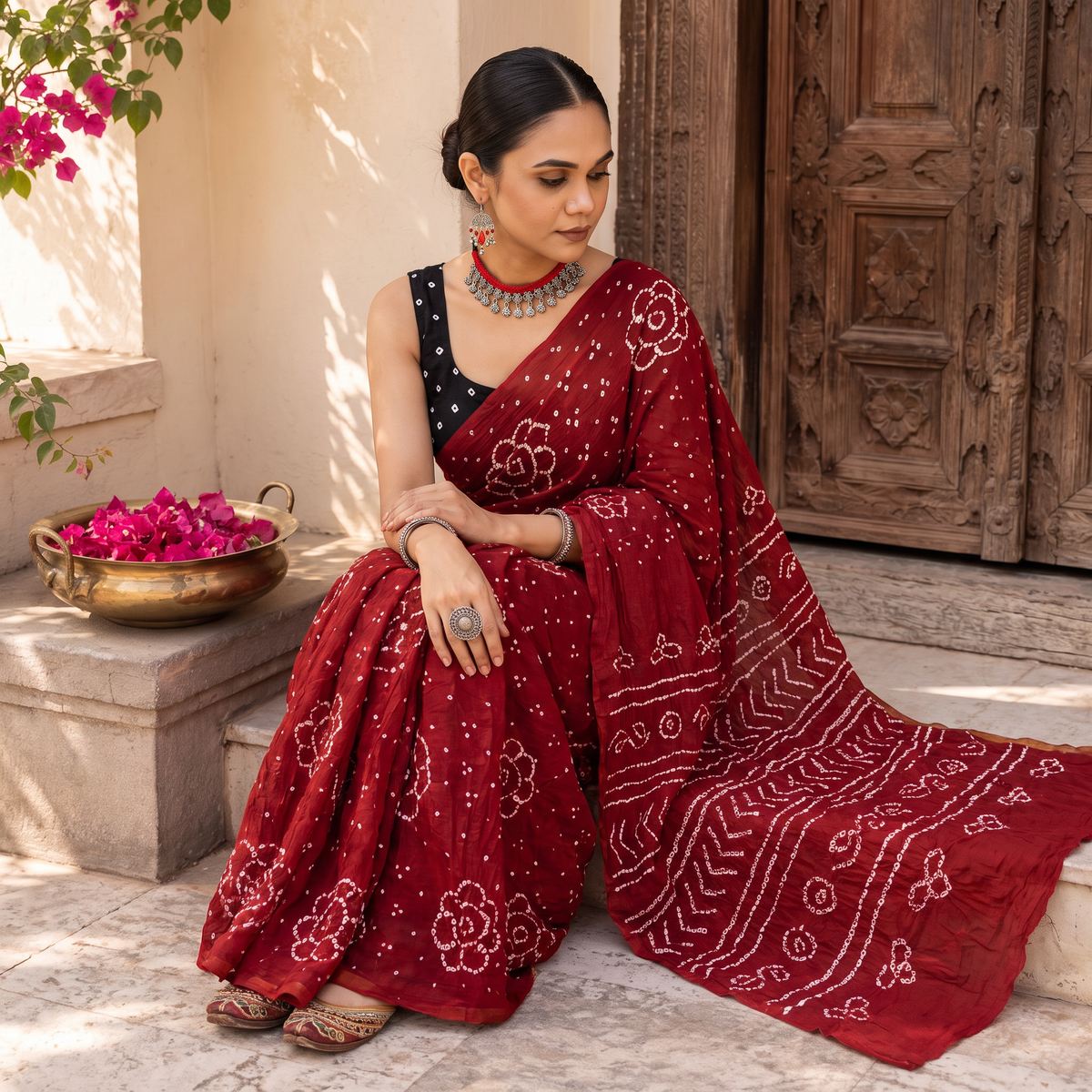 Red Kutch Bandhani tie-dye cotton saree, draped and worn by a woman, AI visual of the saree, iTokri