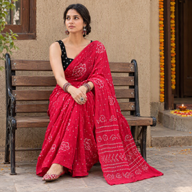 Pink Kutch Bandhani tie-dye cotton saree, draped and worn by a woman, AI visual of the saree, iTokri