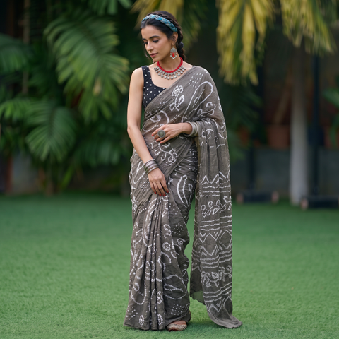 Grey Kutch Bandhani tie-dye cotton saree, draped and worn by a woman, AI visual of the saree, iTokri