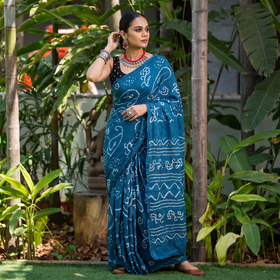Blue Kutch Bandhani tie-dye cotton saree, draped and worn by a woman, AI visual of the saree, iTokri