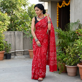 Pink Kutch Bandhani tie-dye cotton saree, draped and worn by a woman, AI visual of the saree, iTokri