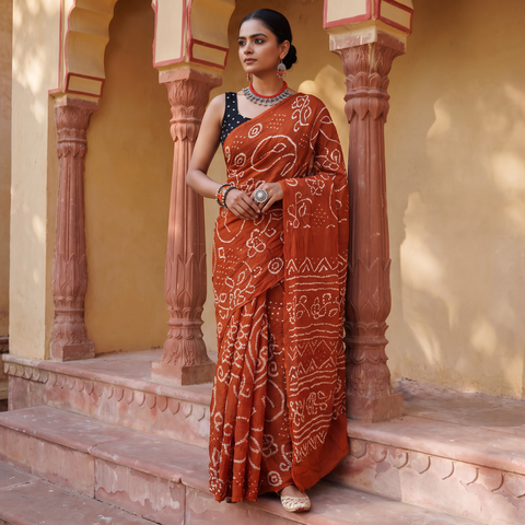 Orange Kutch Bandhani tie-dye cotton saree, draped and worn by a woman, AI visual of the saree, iTokri