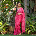 Pink Kutch Bandhani tie-dye cotton saree, draped and worn by a woman, AI visual of the saree, iTokri