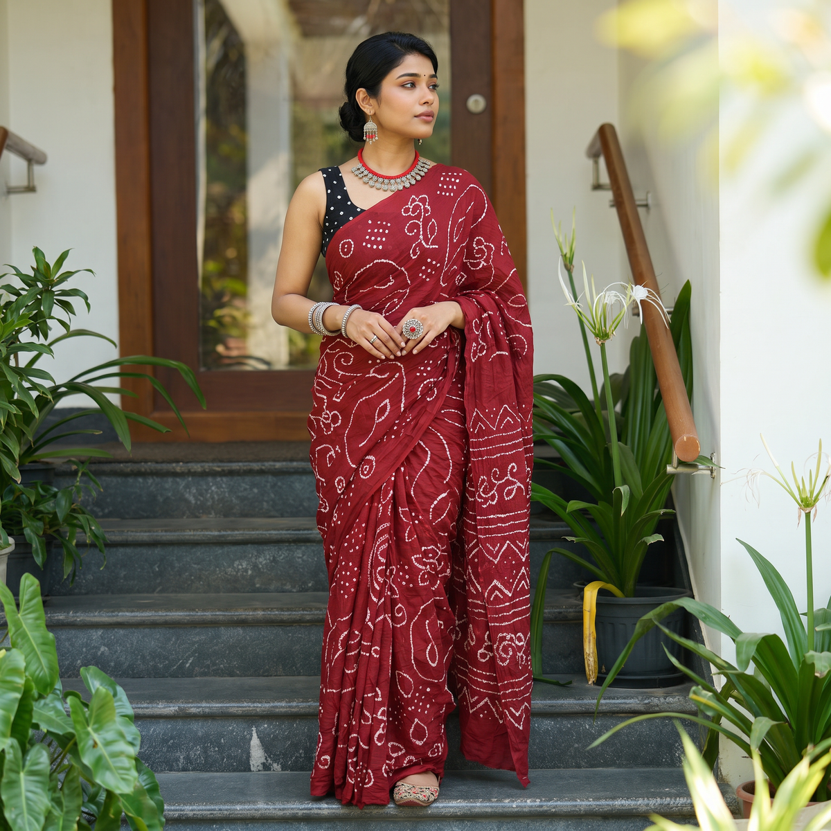 Red Kutch Bandhani tie-dye cotton saree, draped and worn by a woman, AI visual of the saree, iTokri