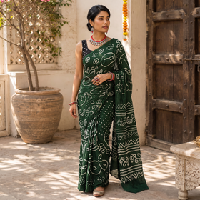 Green Kutch Bandhani tie-dye cotton saree, draped and worn by a woman, AI visual of the saree, iTokri