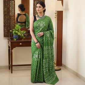 Green Kutch Bandhani tie-dye cotton saree, draped and worn by a woman, AI visual of the saree, iTokri