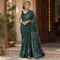 Green Kutch Bandhani tie-dye cotton saree, draped and worn by a woman, AI visual of the saree, iTokri