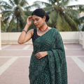 Green Kutch Bandhani tie-dye cotton saree, draped and worn by a woman, AI visual of the saree, iTokri