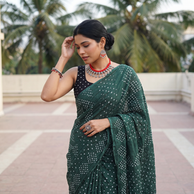 Green Kutch Bandhani tie-dye cotton saree, draped and worn by a woman, AI visual of the saree, iTokri