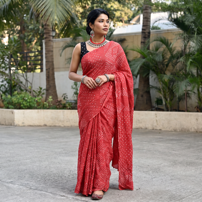 Pink Kutch Bandhani tie-dye cotton saree, draped and worn by a woman, AI visual of the saree, iTokri