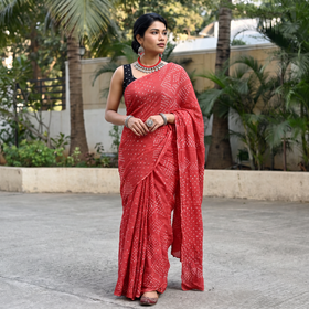 Pink Kutch Bandhani tie-dye cotton saree, draped and worn by a woman, AI visual of the saree, iTokri
