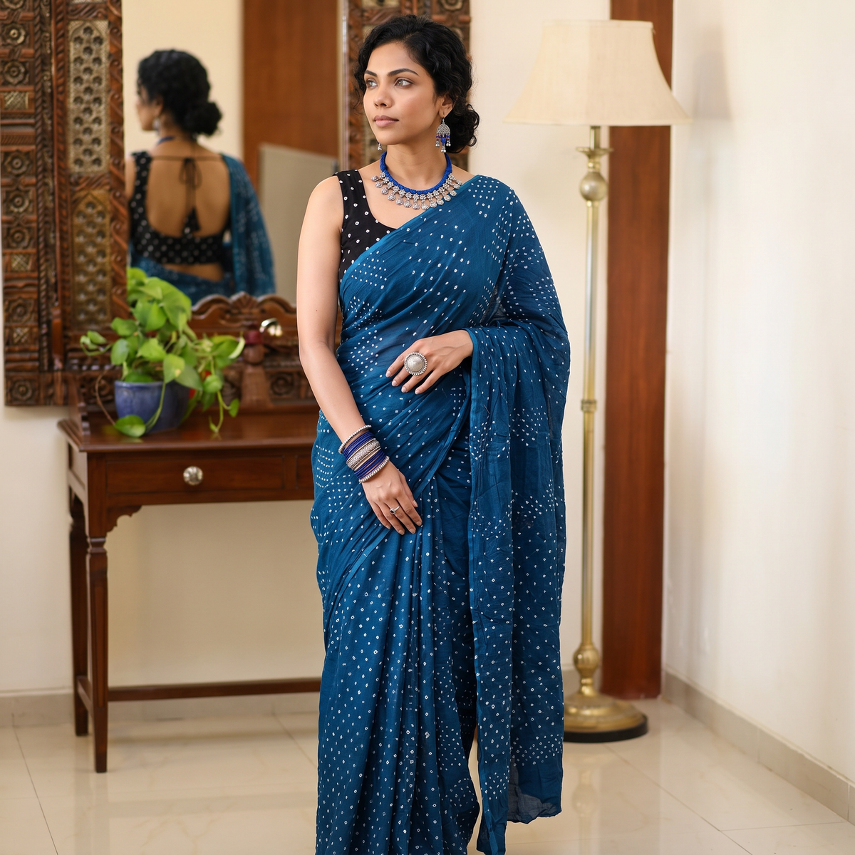Blue Kutch Bandhani tie-dye cotton saree, draped and worn by a woman, AI visual of the saree, iTokri