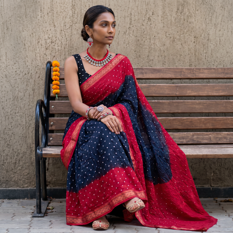 Blue Kutch Bandhani tie-dye cotton saree, draped and worn by a woman, AI visual of the saree, iTokri