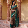 Brown Kutch Bandhani tie-dye cotton saree, draped and worn by a woman, AI visual of the saree, iTokri