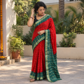 Red Kutch Bandhani tie-dye cotton saree, draped and worn by a woman, AI visual of the saree, iTokri