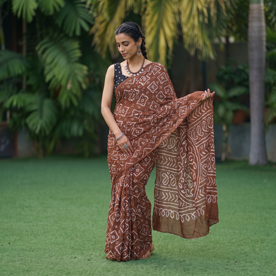 Brown Kutch Bandhani tie-dye cotton saree, draped and worn by a woman, AI visual of the saree, iTokri