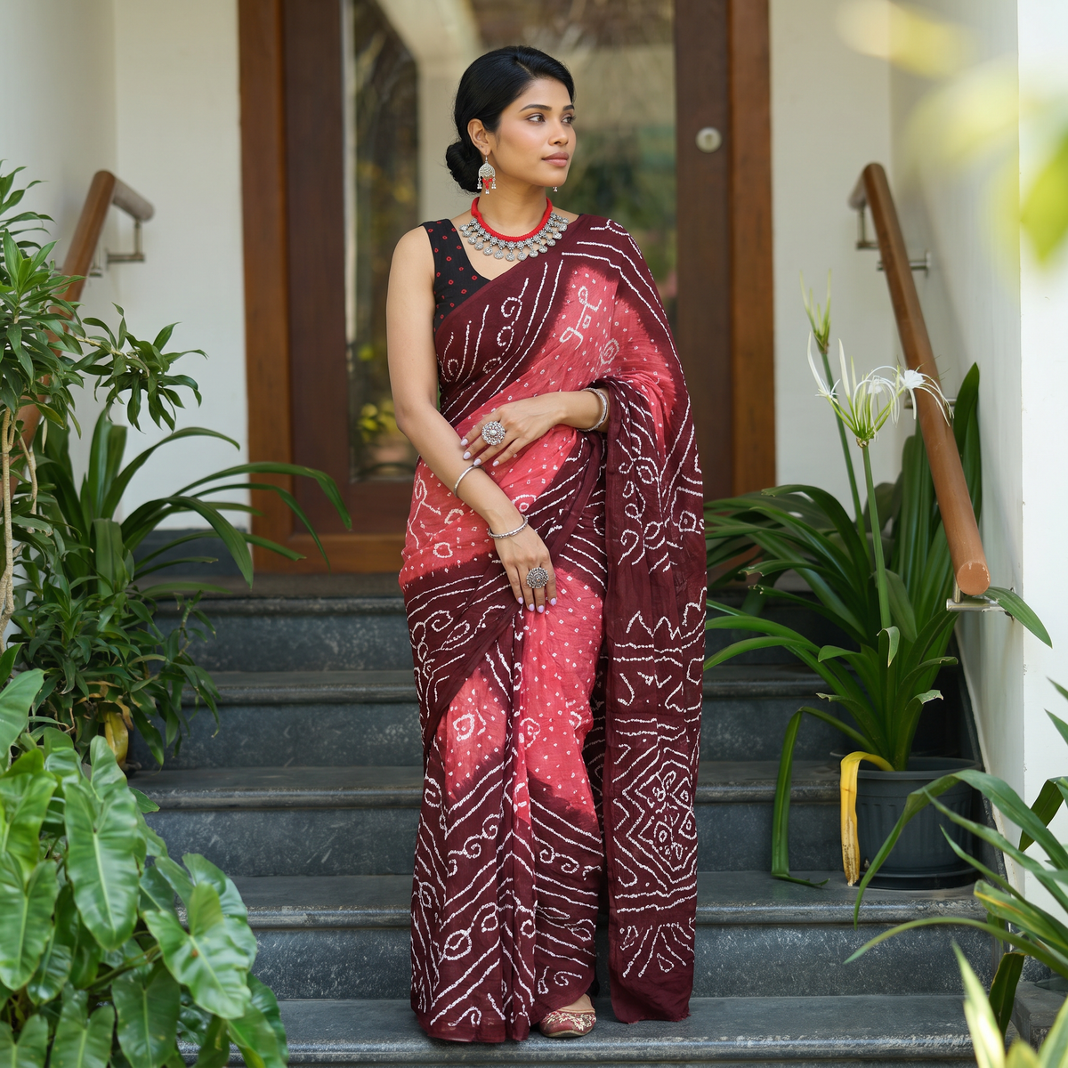 Maroon Kutch Bandhani tie-dye cotton saree, draped and worn by a woman, AI visual of the saree, iTokri