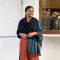 Black Kutch Bandhani Tie-Dye Handwoven Merino Wool Shawl, worn by a model, AI visual of the shawl, iTokri