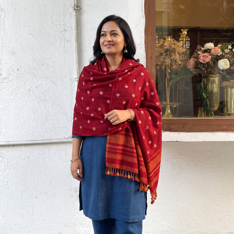 Red Kutch Bandhani Tie-Dye Handwoven Merino Wool Shawl, worn by a model, AI visual of the shawl, iTokri