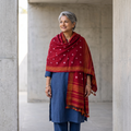 Red Kutch Bandhani Tie-Dye Handwoven Merino Wool Shawl, worn by a model, AI visual of the shawl, iTokri