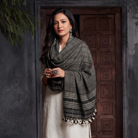Black Kutch Bhujodi Handwoven Merino Wool Shawl, worn by a model, AI visual of the shawl, iTokri