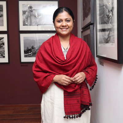 Red Kutch Bhujodi Handwoven Merino Wool Shawl, worn by a model, AI visual of the shawl, iTokri