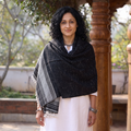 Black Kutch Bhujodi Handwoven Merino Wool Shawl, worn by a model, AI visual of the shawl, iTokri