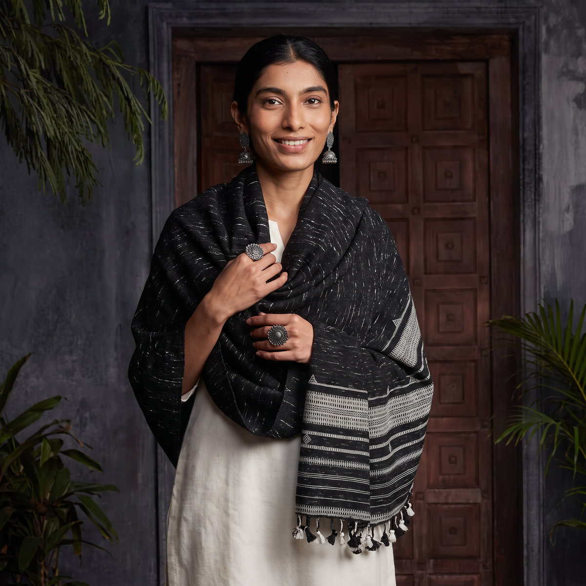 Black Kutch Bhujodi Handwoven Merino Wool Shawl, worn by a model, AI visual of the shawl, iTokri