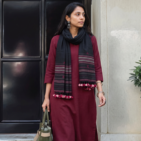 Black Kutch Bhujodi Handwoven Merino Wool Stole, worn by a woman, AI visual of the stole, iTokri