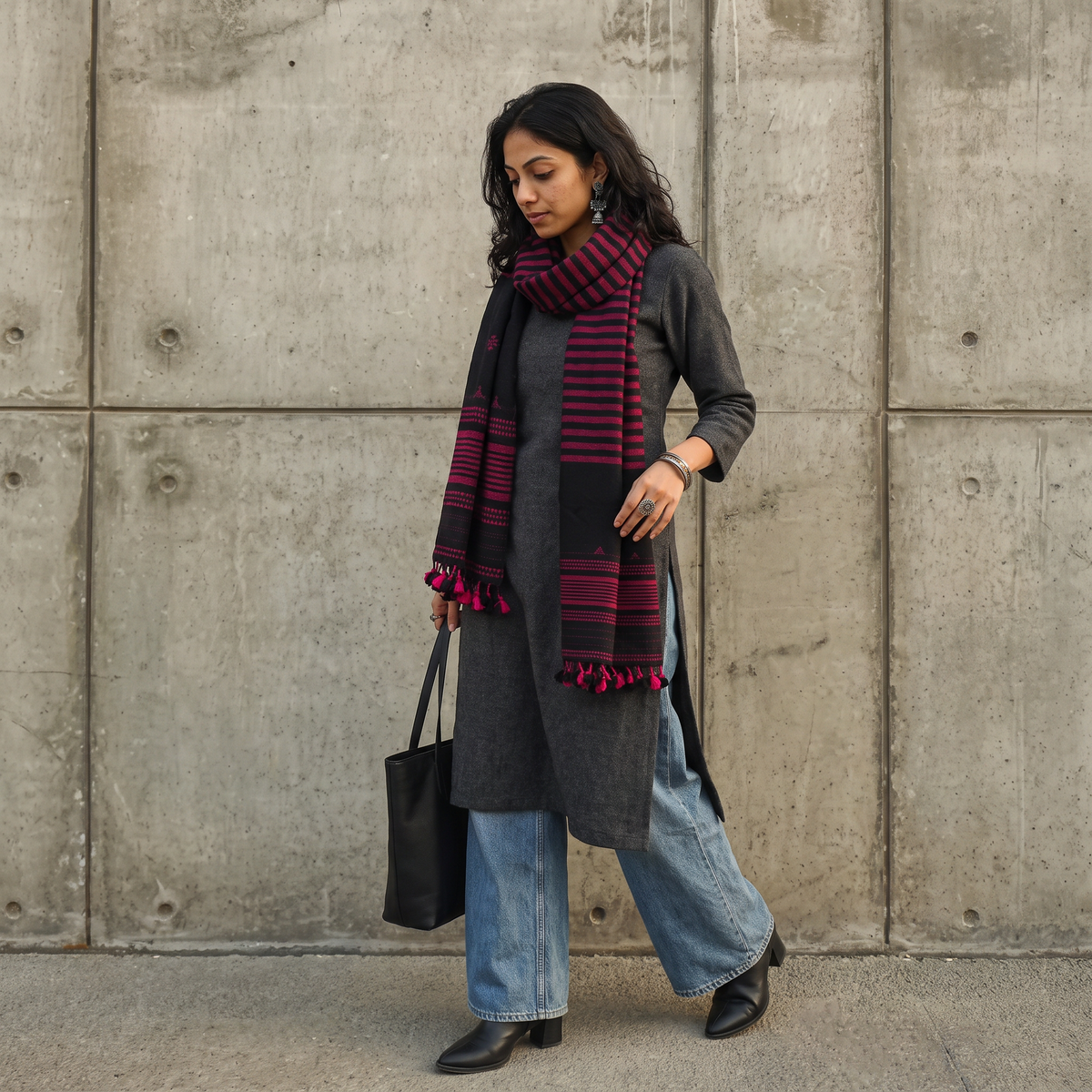 Black Kutch Bhujodi Handwoven Merino Wool Stole, worn by a woman, AI visual of the stole, iTokri