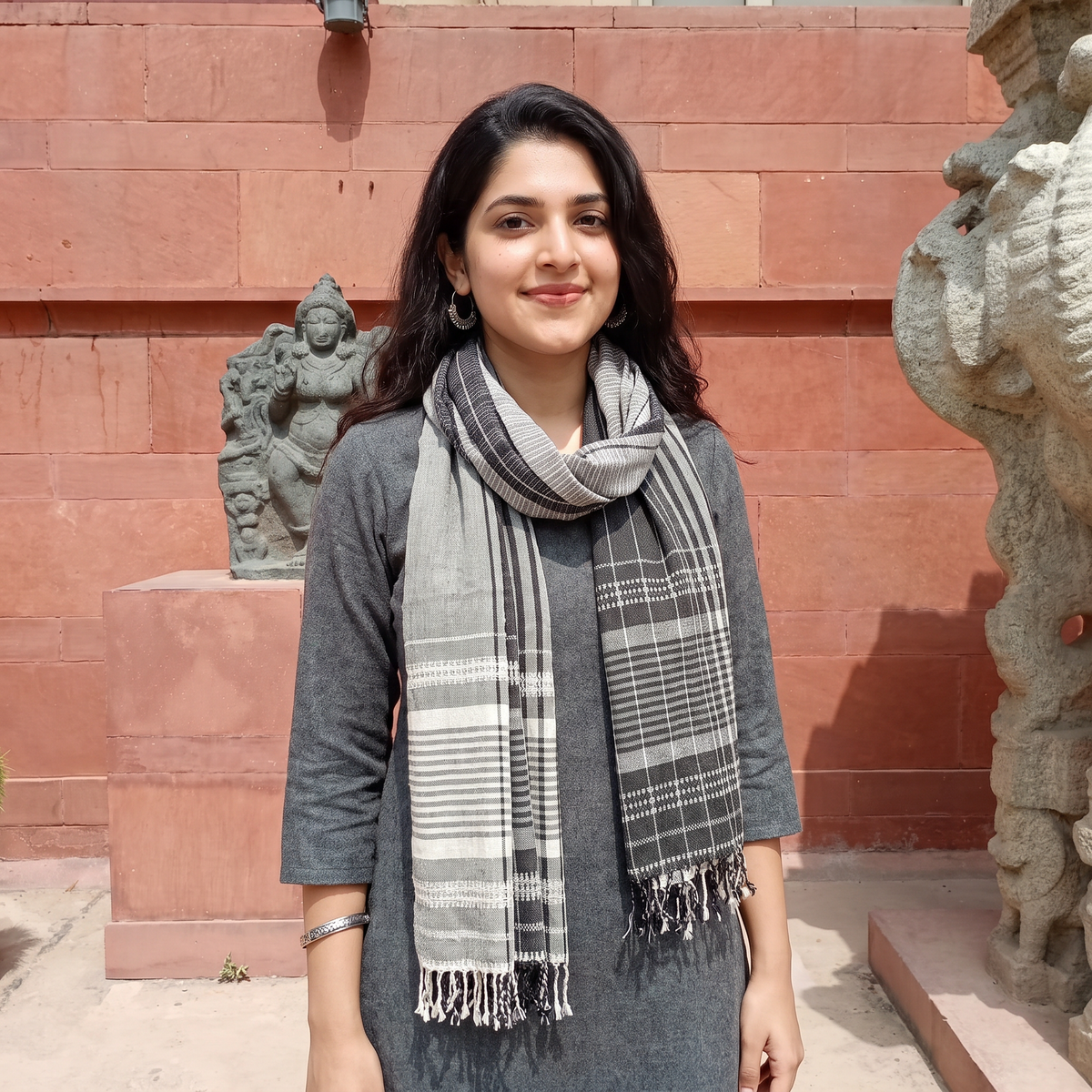 Grey Kutch Bhujodi Handwoven Merino Wool Stole, worn by a woman, AI visual of the stole, iTokri
