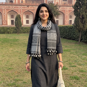Grey Kutch Bhujodi Handwoven Merino Wool Stole, worn by a woman, AI visual of the stole, iTokri