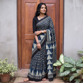 Blue Kutch Hand Block Print Natural Dyed Pure Mul Cotton Ajrakh Saree with Tassels, draped and worn by a woman, AI visual of the saree, iTokri
