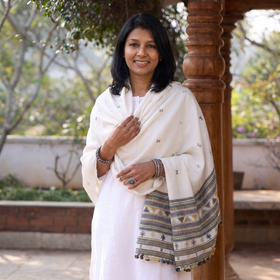 White Kutch Handwoven Acrylic Wool Shawl, worn by a model, AI visual of the shawl, iTokri