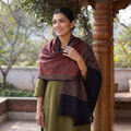 Maroon Kutch Handwoven Ajrakh Hand Block Print Merino Wool Shawl, worn by a model, AI visual of the shawl, iTokri