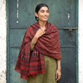 Red Kutch Handwoven Ajrakh Hand Block Print Merino Wool Shawl, worn by a model, AI visual of the shawl, iTokri