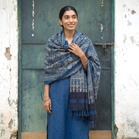 Blue Kutch Handwoven Ajrakh Hand Block Print Merino Wool Shawl, worn by a model, AI visual of the shawl, iTokri