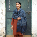 Blue Kutch Handwoven Ajrakh Hand Block Print Merino Wool Shawl, worn by a model, AI visual of the shawl, iTokri