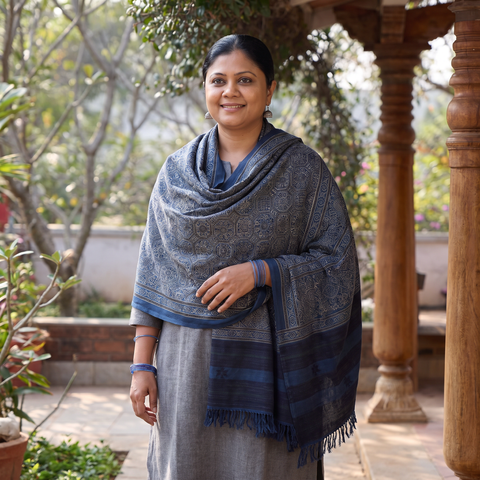 Grey Kutch Handwoven Ajrakh Hand Block Print Merino Wool Shawl, worn by a model, AI visual of the shawl, iTokri
