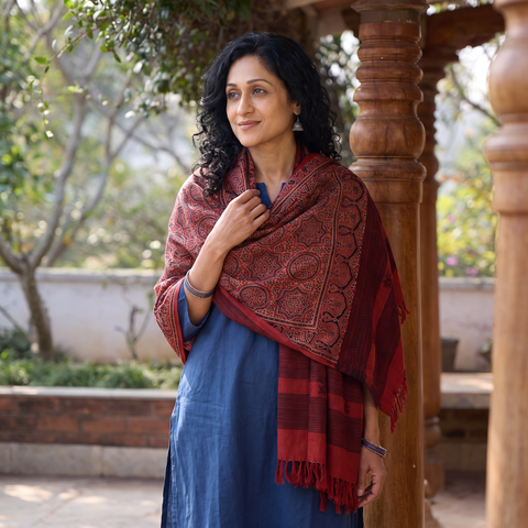 Red Kutch Handwoven Ajrakh Hand Block Print Merino Wool Shawl, worn by a model, AI visual of the shawl, iTokri
