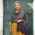 Grey Kutch Handwoven Ajrakh Hand Block Print Merino Wool Shawl, worn by a model, AI visual of the shawl, iTokri