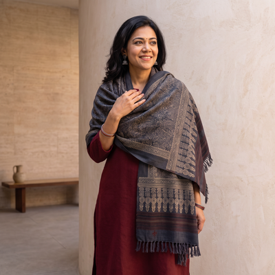 Grey Kutch Handwoven Ajrakh Hand Block Print Merino Wool Shawl, worn by a model, AI visual of the shawl, iTokri