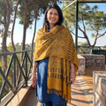 Yellow Kutch Handwoven Ajrakh Hand Block Print Merino Wool Shawl, worn by a model, AI visual of the shawl, iTokri