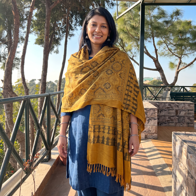 Yellow Kutch Handwoven Ajrakh Hand Block Print Merino Wool Shawl, worn by a model, AI visual of the shawl, iTokri